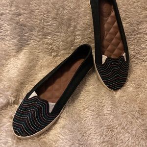Size 8 Women’s Canvas Reef slip ons.Never worn.Black with multi color design